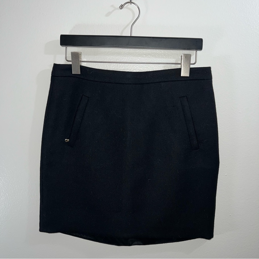 J.Crew black wool pencil skirt with front zipper pockets and high low hem size 4